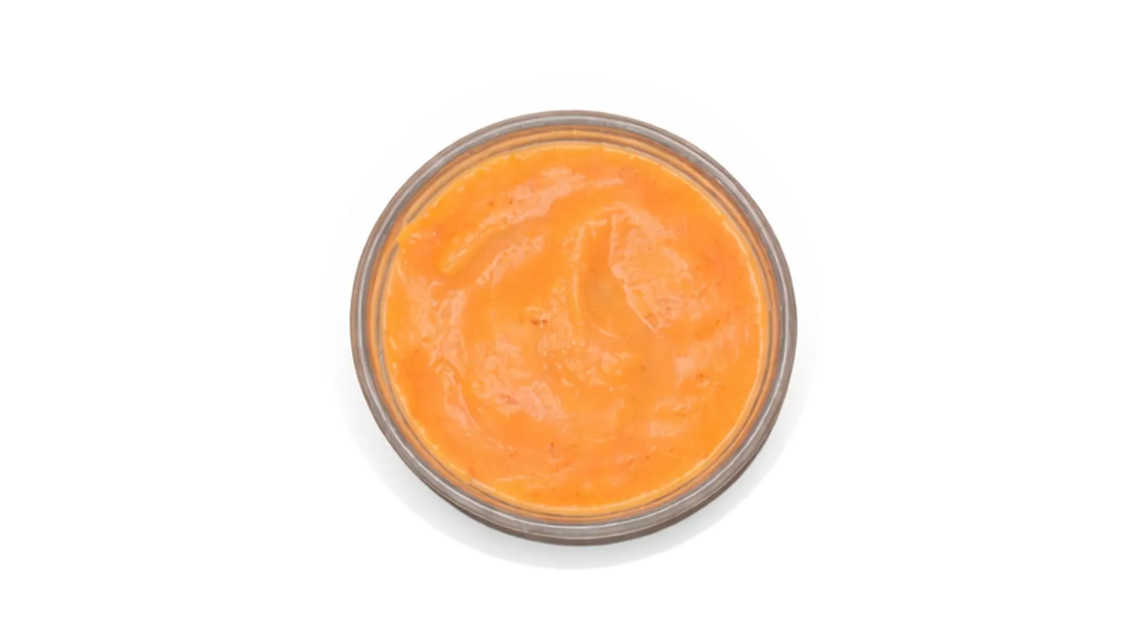 Cup of orange Nomad sauce